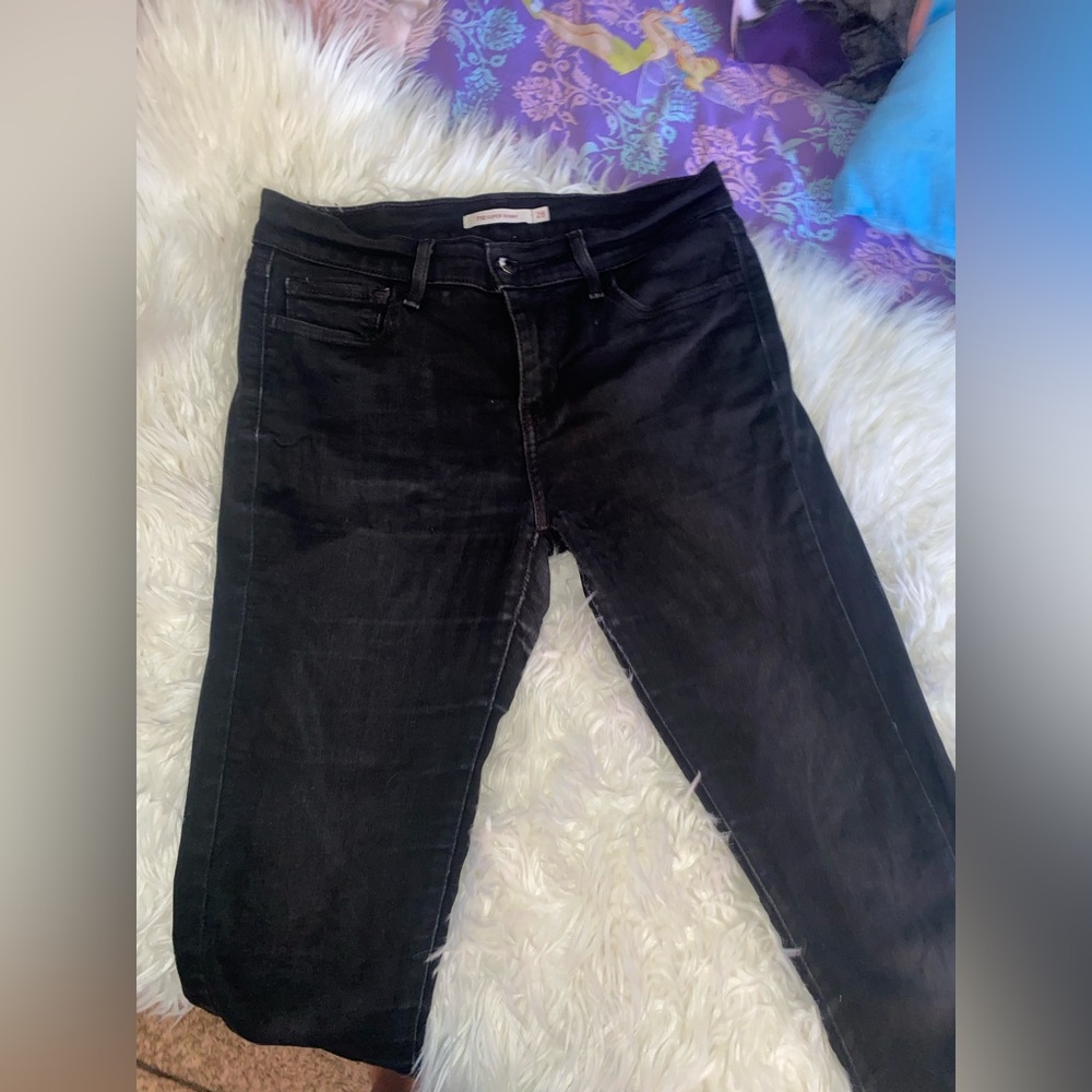 Woman’s 710 super skinny size 28 black faded and used Levi’s